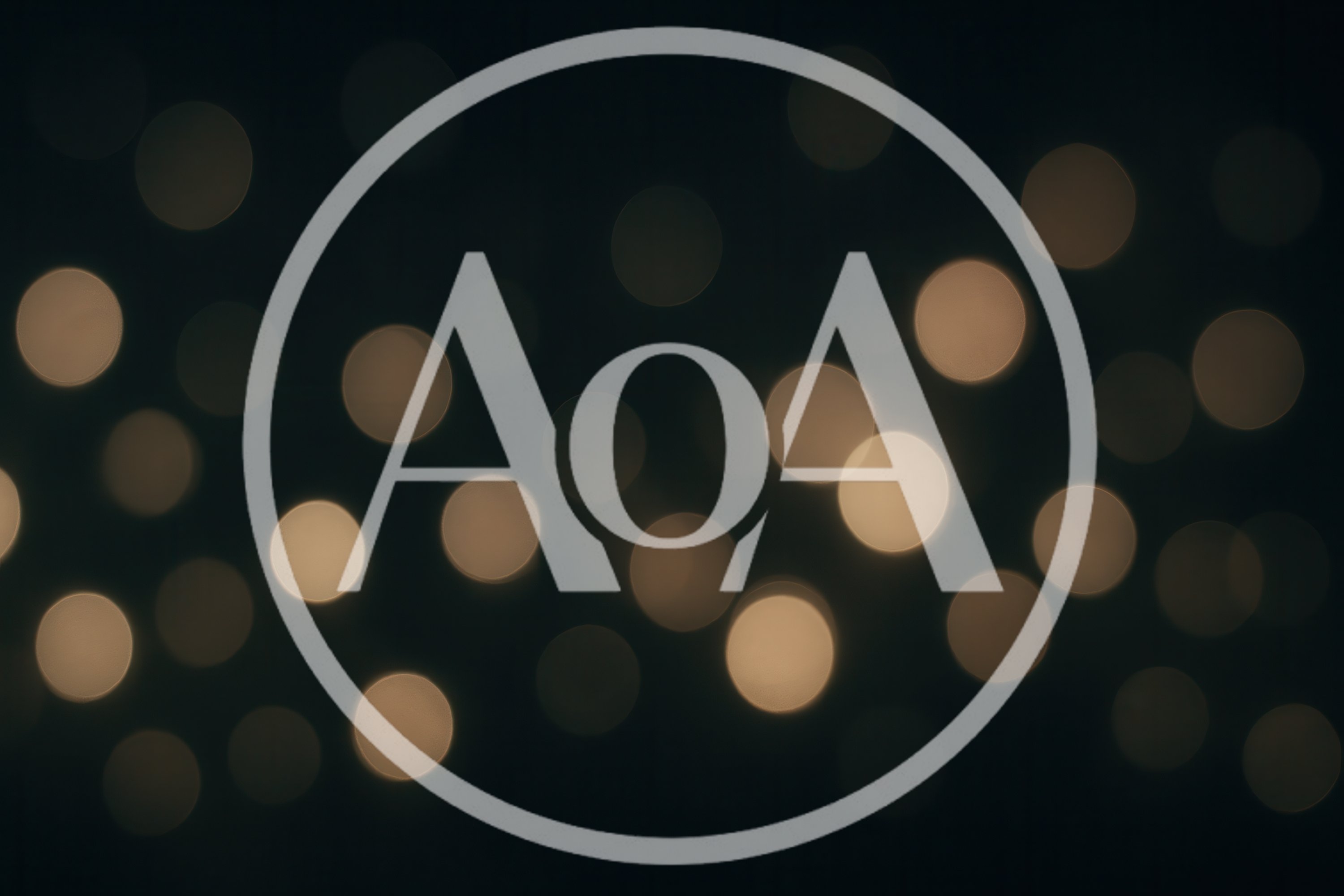 Abstract Golden Bokeh Lights On Dark Background