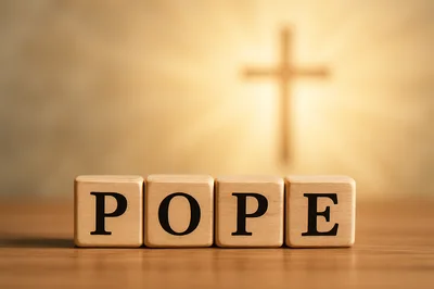 Wooden Blocks Spelling Pope With A Glowing Cross Background