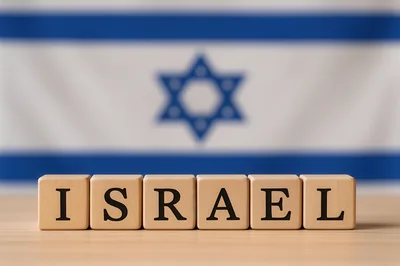 Wooden Blocks Spelling Israel With National Flag Background