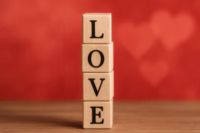 Wooden Blocks Spelling Love Stacked Vertically