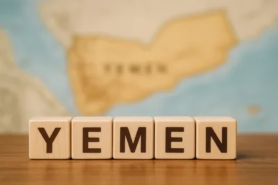 Wooden Blocks Spelling Yemen On A Wooden Surface