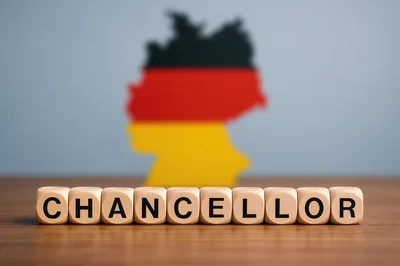 Wooden Letter Blocks Spelling Chancellor With German Map Background