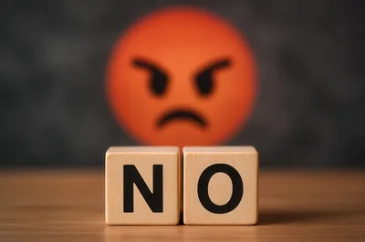 Wooden Blocks Spelling No With Angry Emoji Background