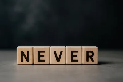Wooden Blocks Spelling The Word Never