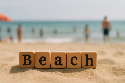Wooden Blocks Spelling Beach On Sandy Shore