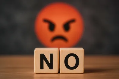 Wooden Blocks Spelling No With Angry Emoji Background