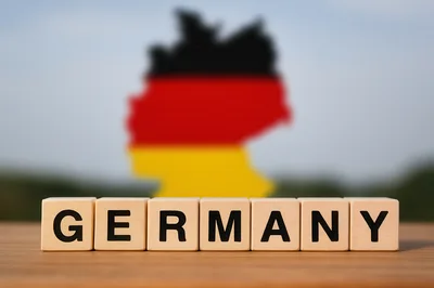 Wooden Blocks Spelling Germany With Map Background