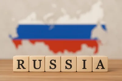 Wooden Blocks Spelling Russia With National Map Background