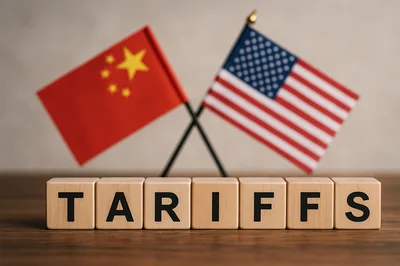 Wooden Blocks Spelling Tariffs With Chinese And American Flags