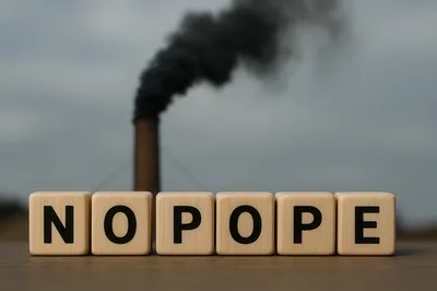 Wooden Blocks Spelling No Pope Before Industrial Smoke Stack