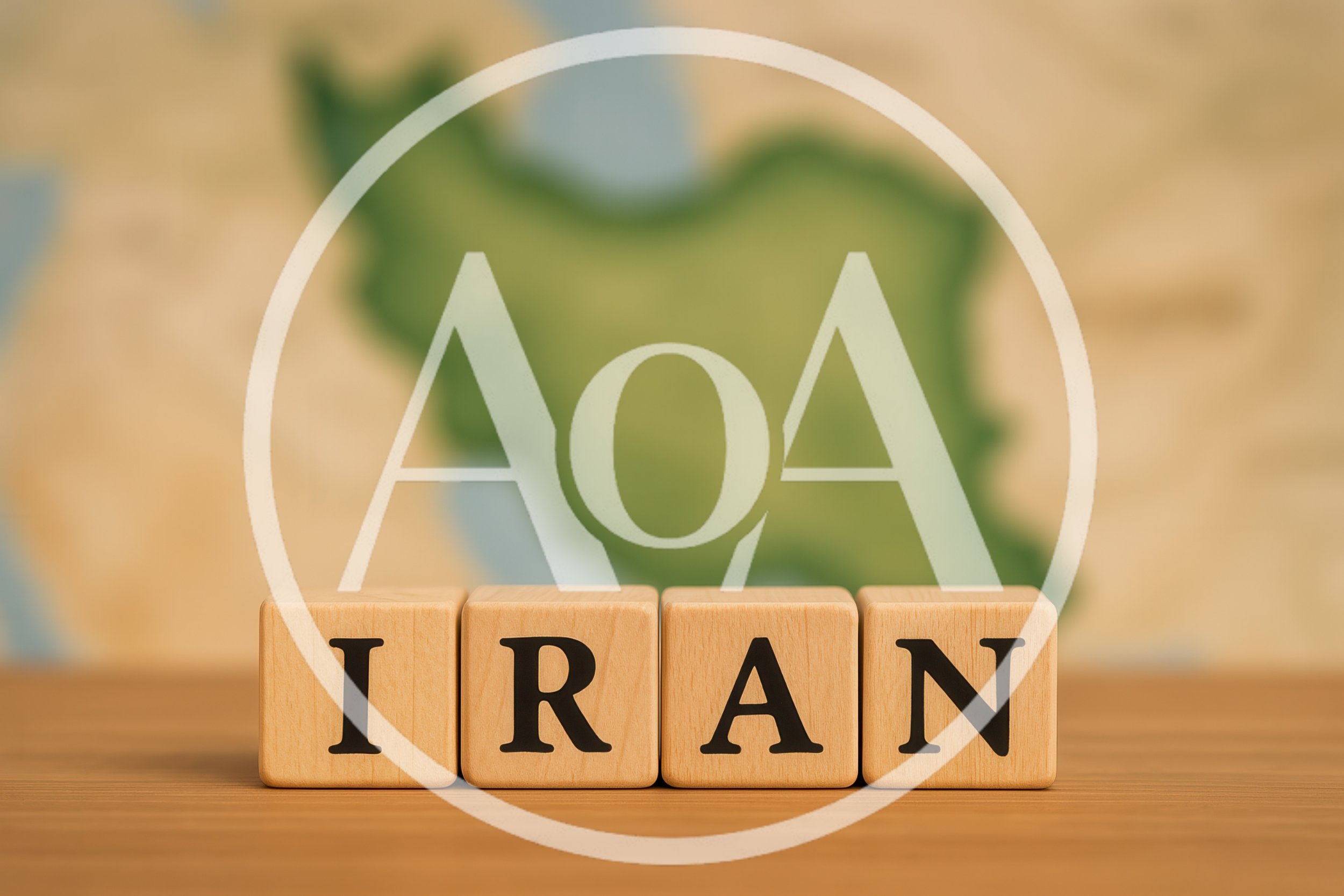 Wooden Blocks Spelling Iran In Front Of Map