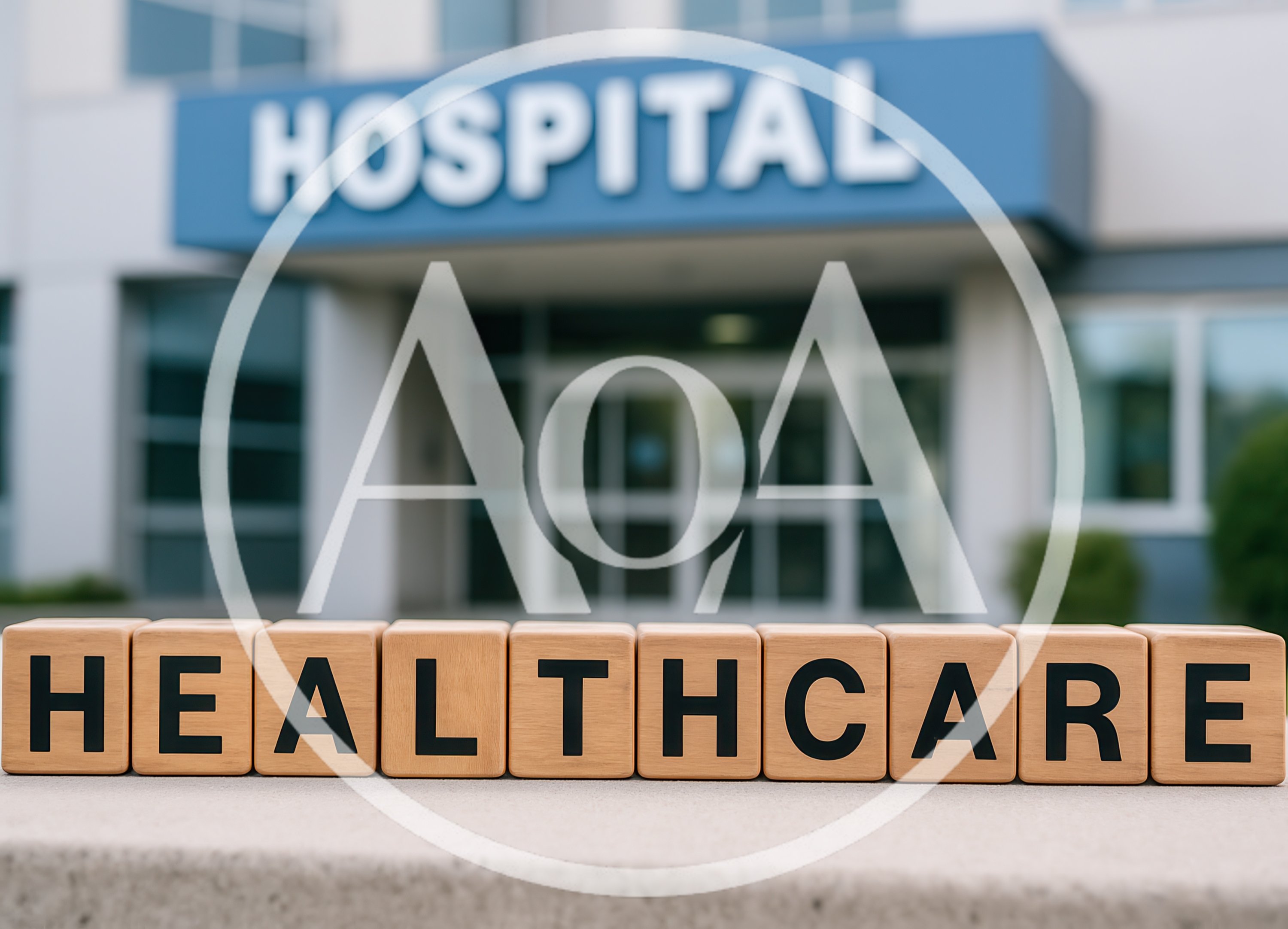 Wooden Blocks Spelling Healthcare In Front Of Hospital Building