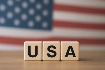 Wooden Blocks Spelling USA With American Flag Background