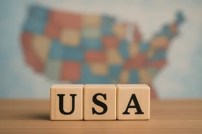 Wooden Blocks Spelling USA With Blurred Map Background