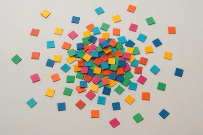 Colorful Square Tiles Scattered On A Neutral Background