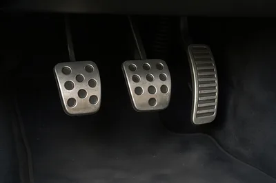 Close Up Of Car Pedals In A Manual Transmission Vehicle