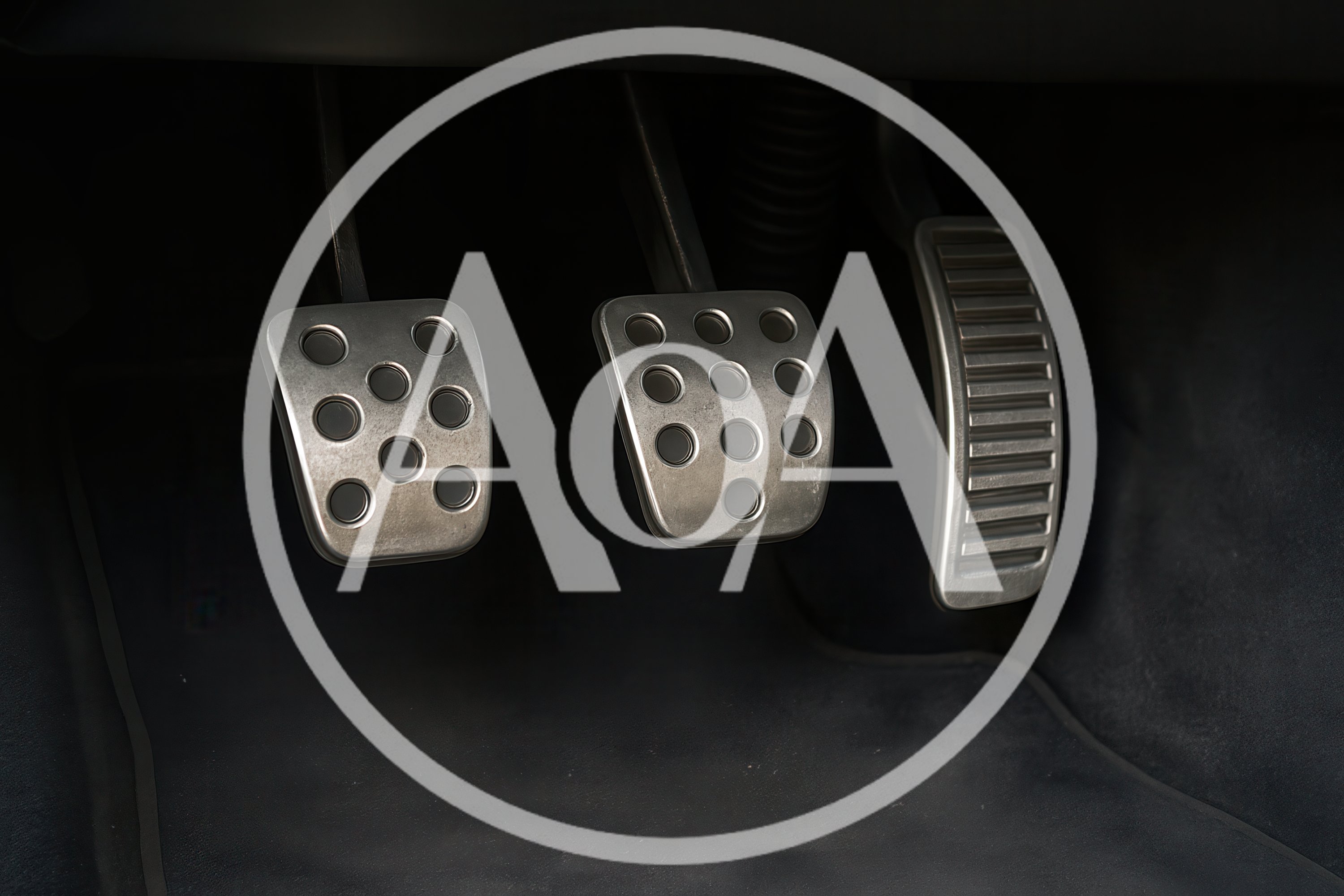 Close Up Of Car Pedals In A Manual Transmission Vehicle