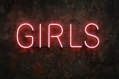Neon Girls Sign On A Dark Textured Wall
