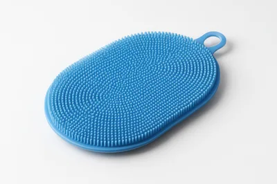 Blue Silicone Body Scrubber On White Background