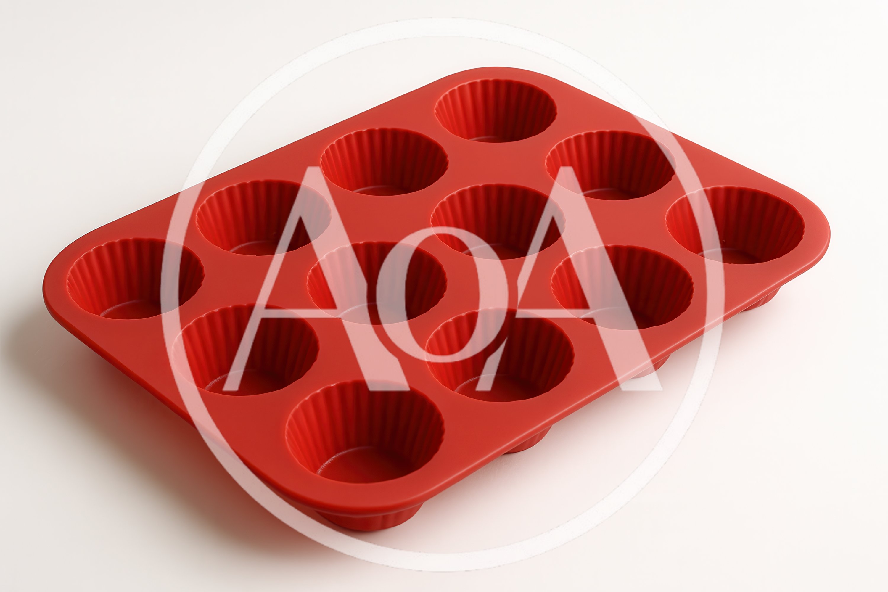 Red Silicone Muffin Pan On White Background