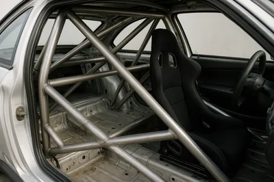 Interior View Of A Stripped Race Car With Roll Cage