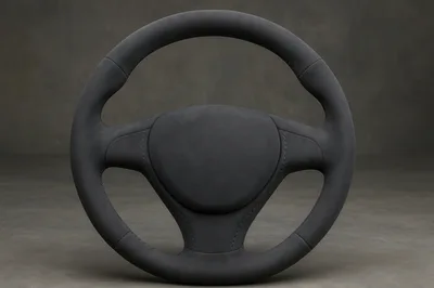 Minimalist Black Leather Steering Wheel On Grey Background