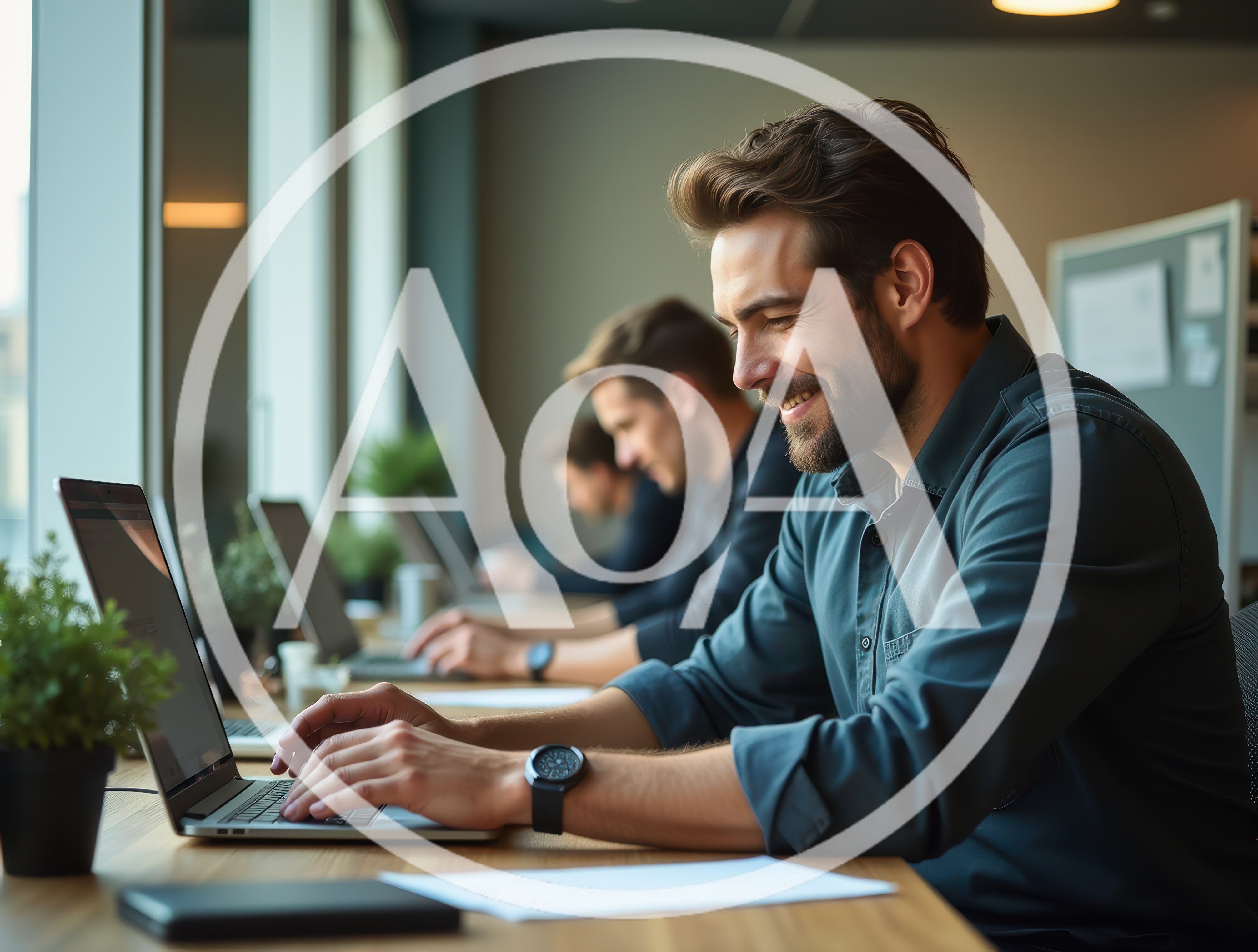 Professional Men Working On Laptops In Modern Office