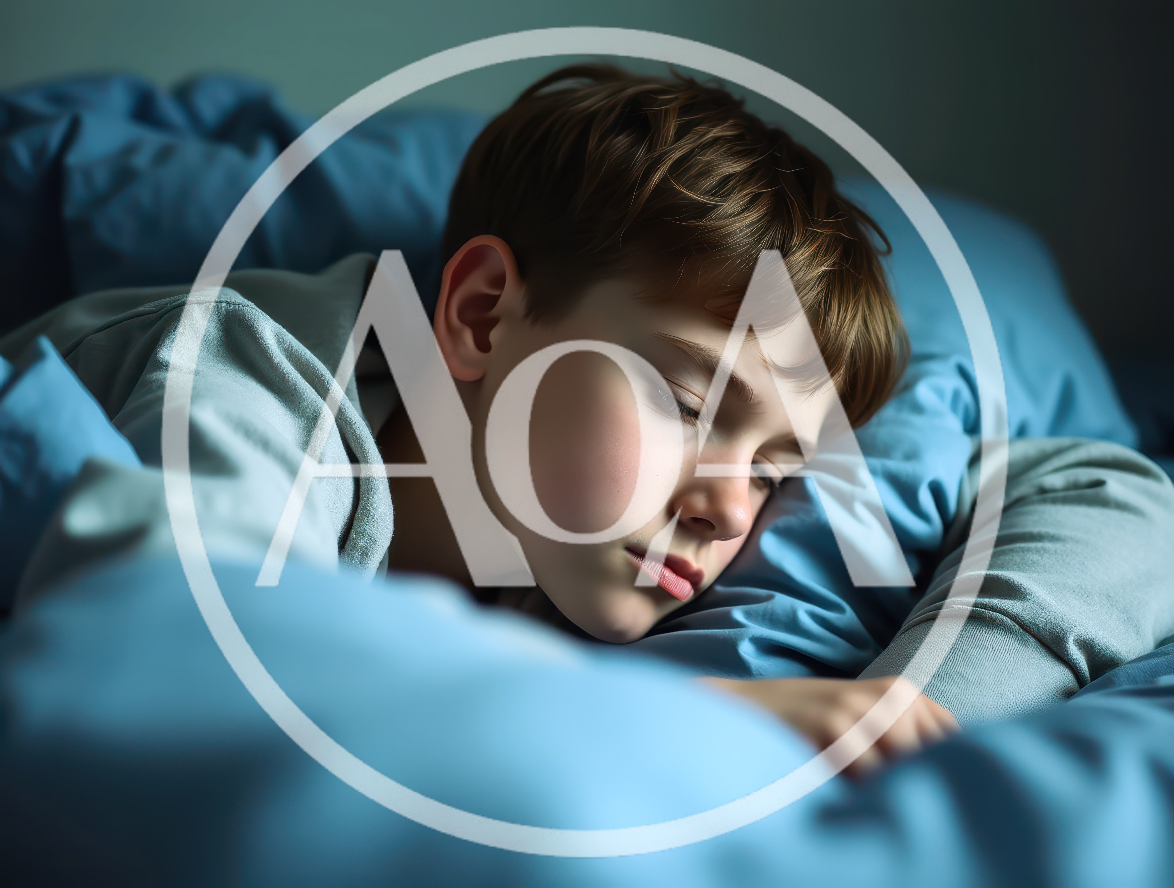 Young Boy Sleeping Peacefully In Bed