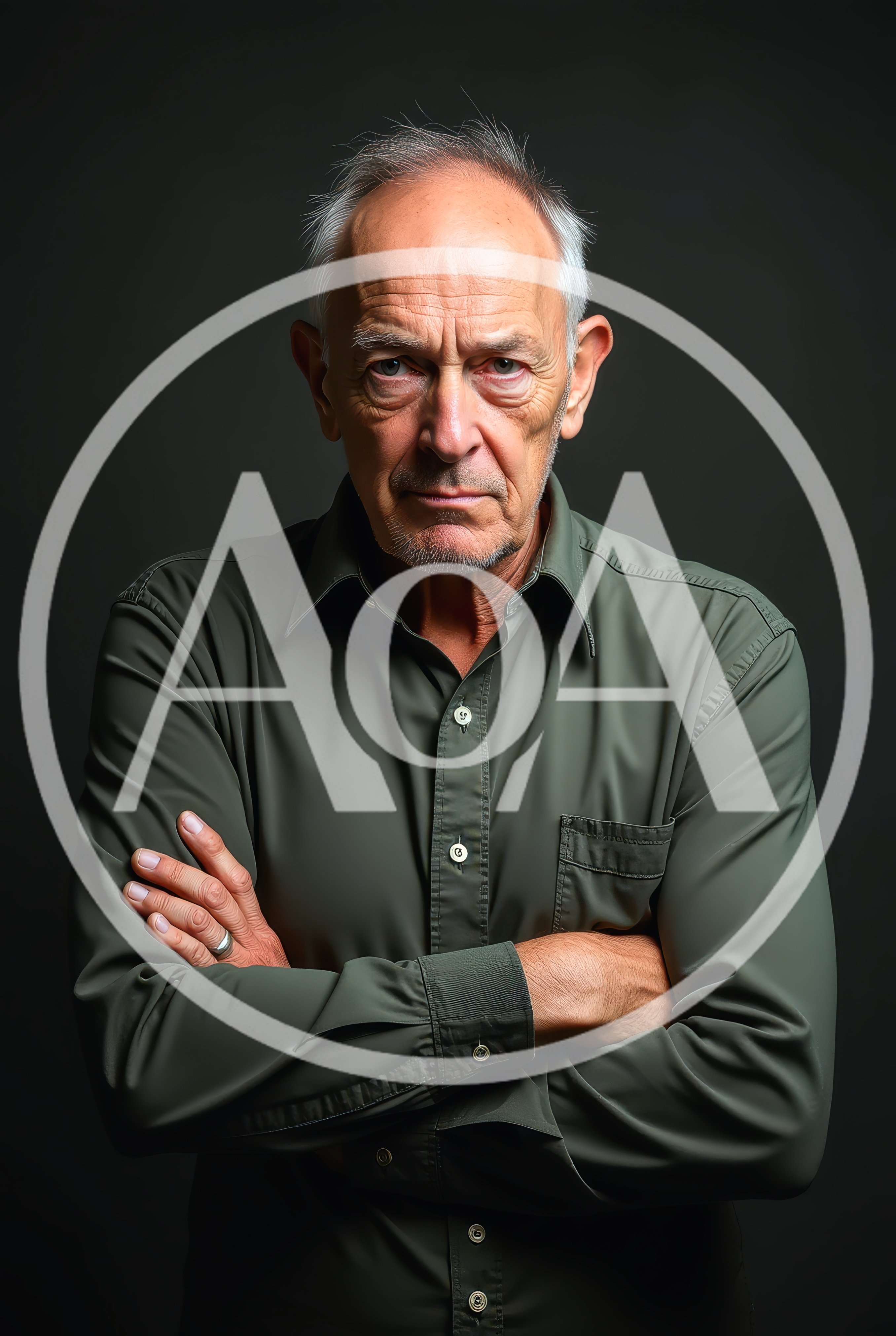 Portrait Of A Serious Older Man With Crossed Arms
