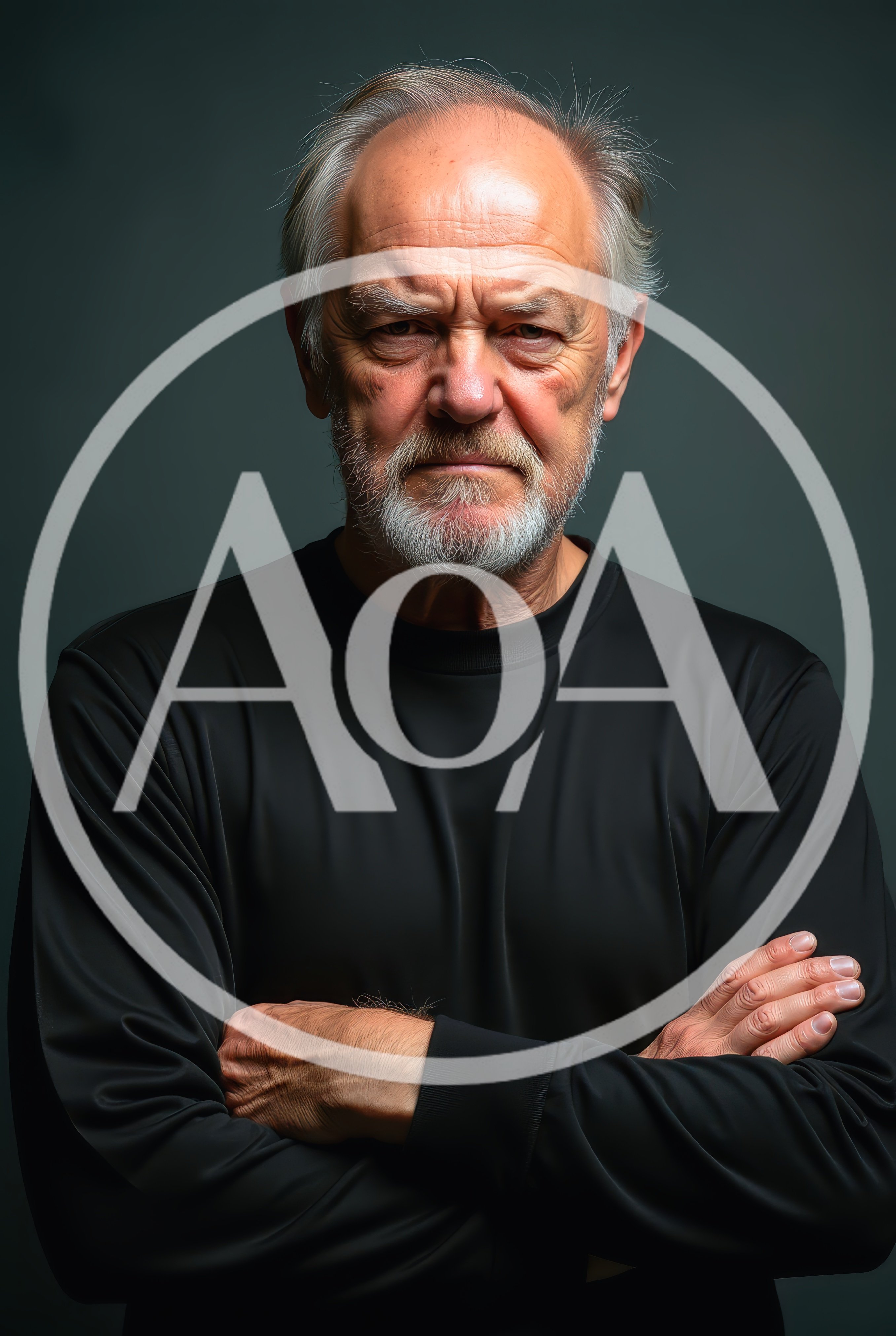 Portrait Of A Stern Senior Man With Crossed Arms