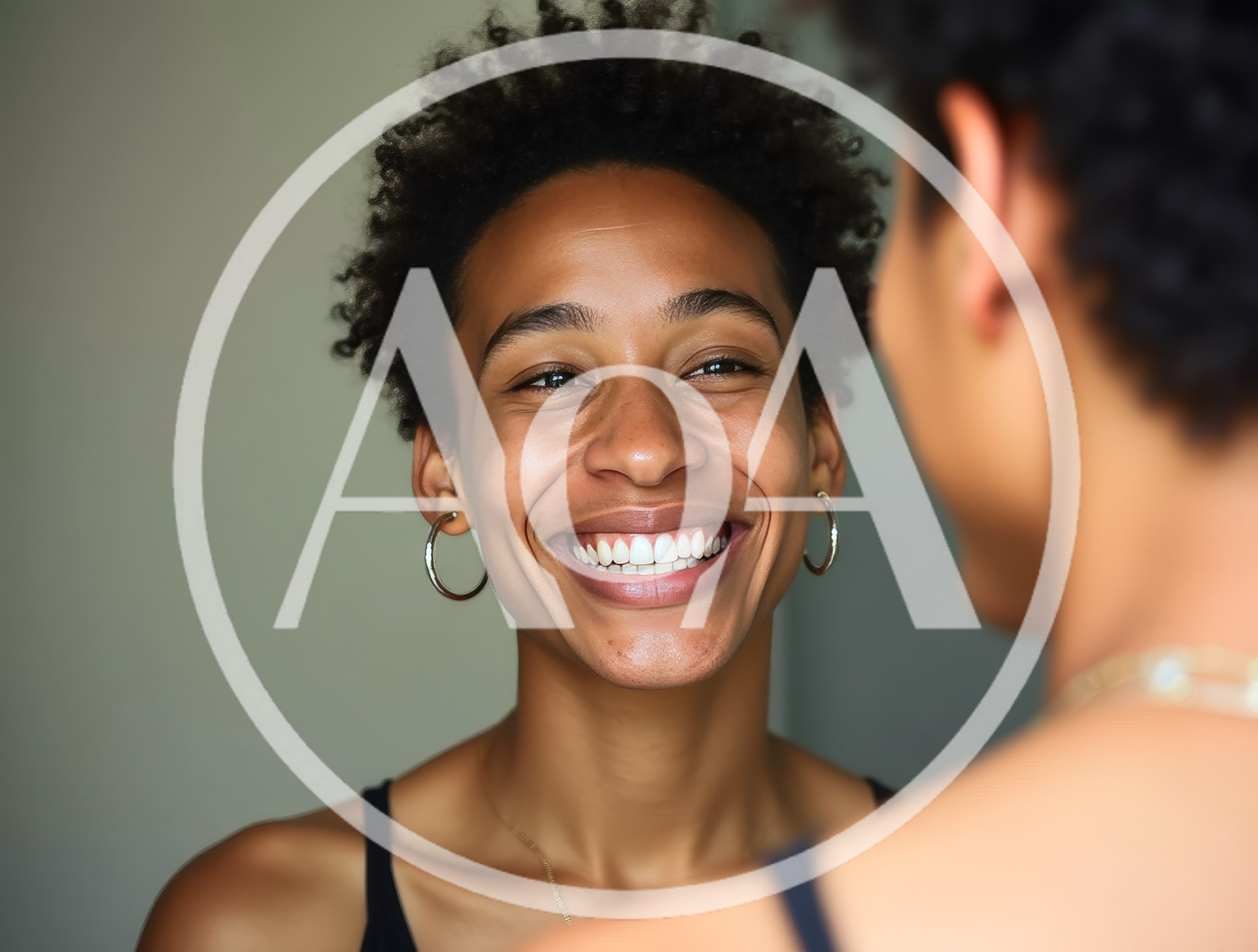 Young Woman Smiling During A Friendly Conversation