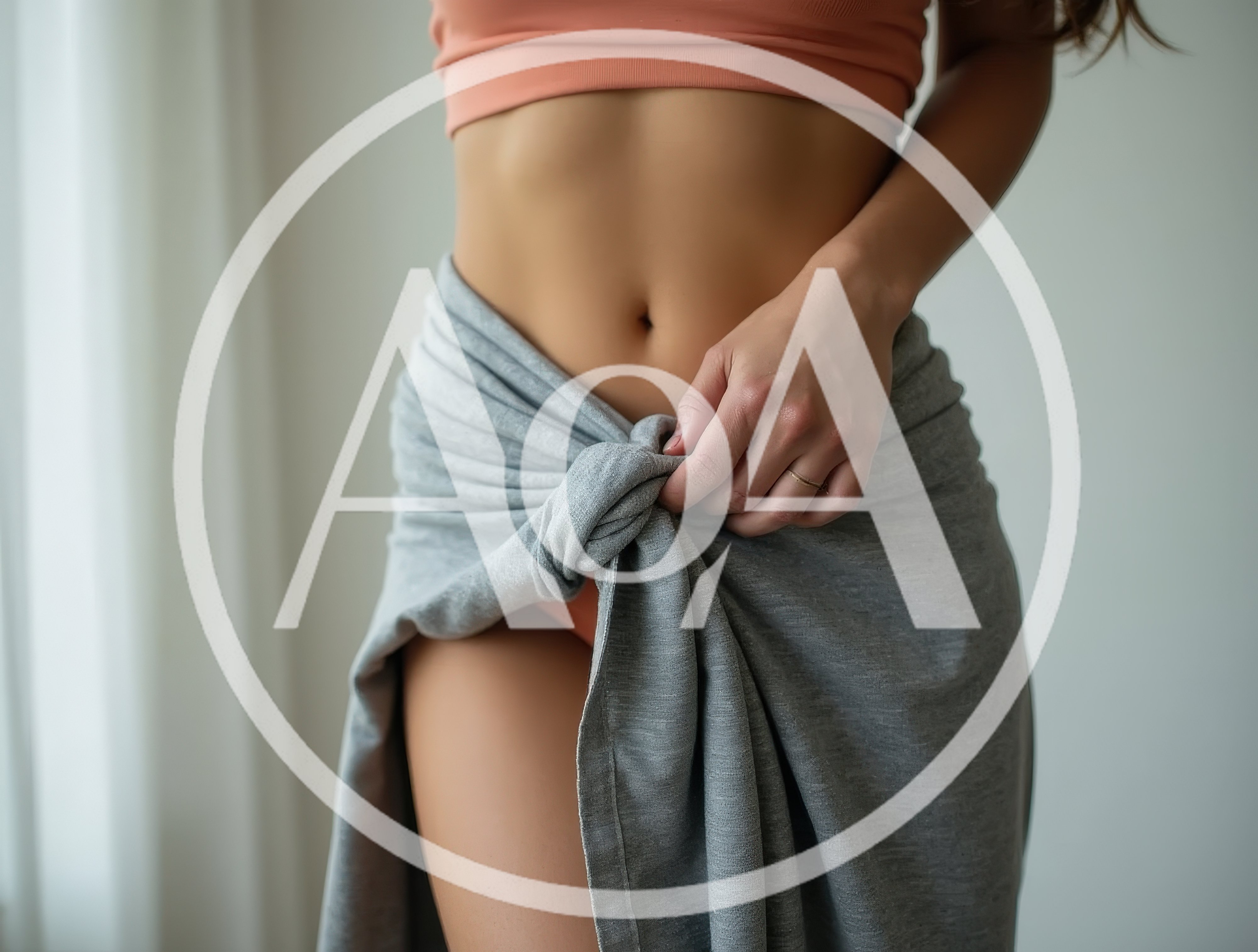 Woman Wearing Peach Sports Bra And Grey Sarong