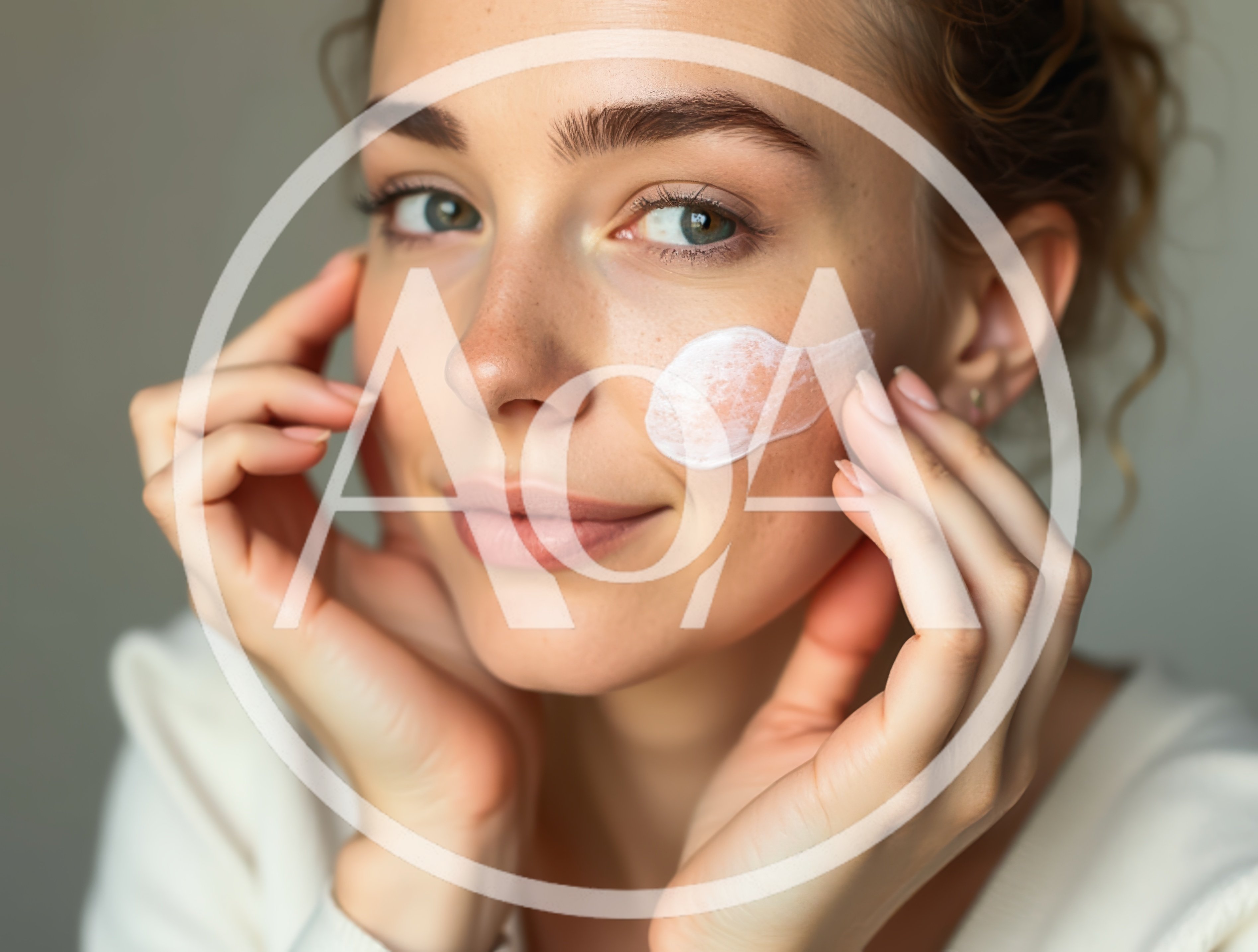 Young Woman Applying Moisturizing Cream To Her Face