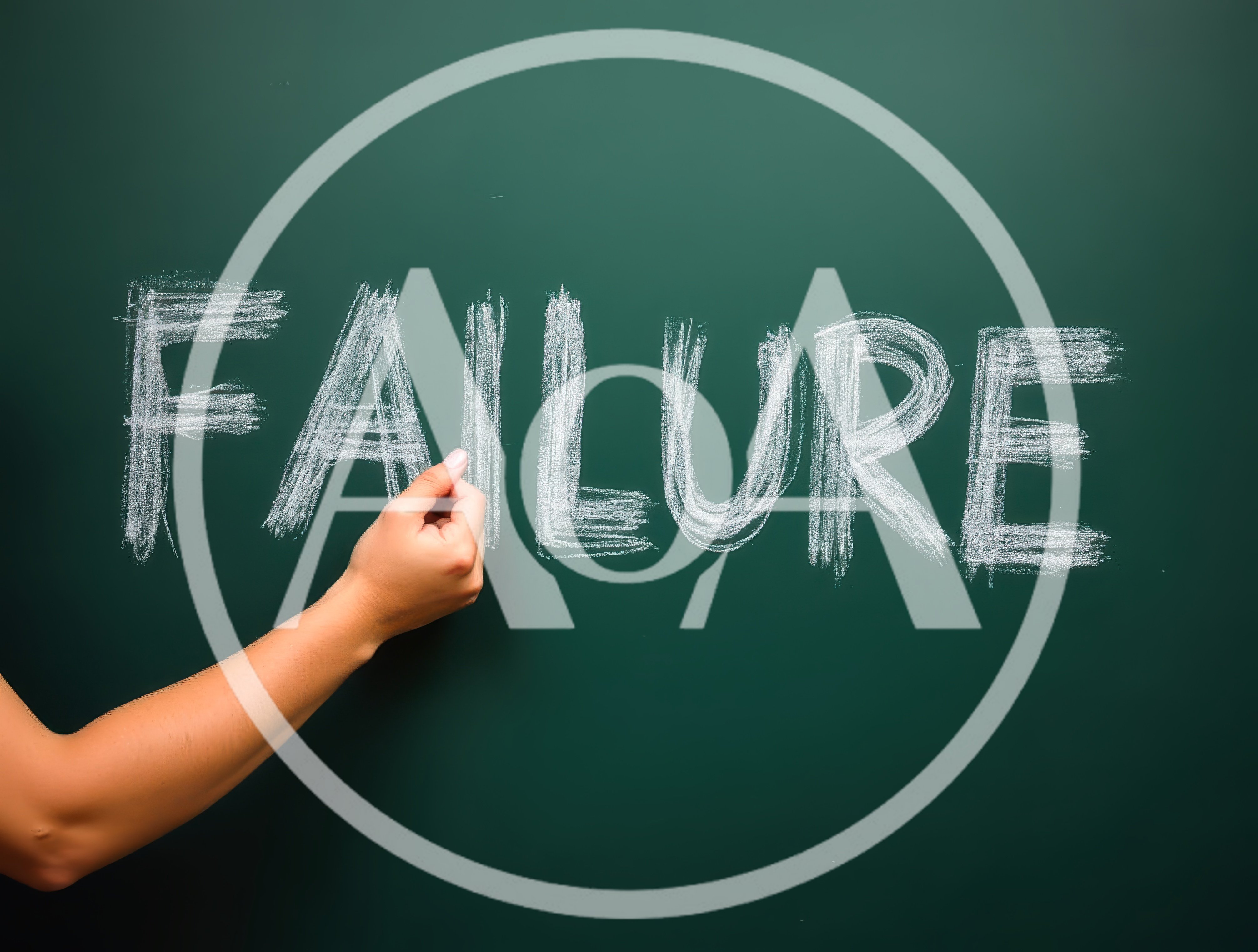 Hand Writing The Word Failure On A Green Chalkboard