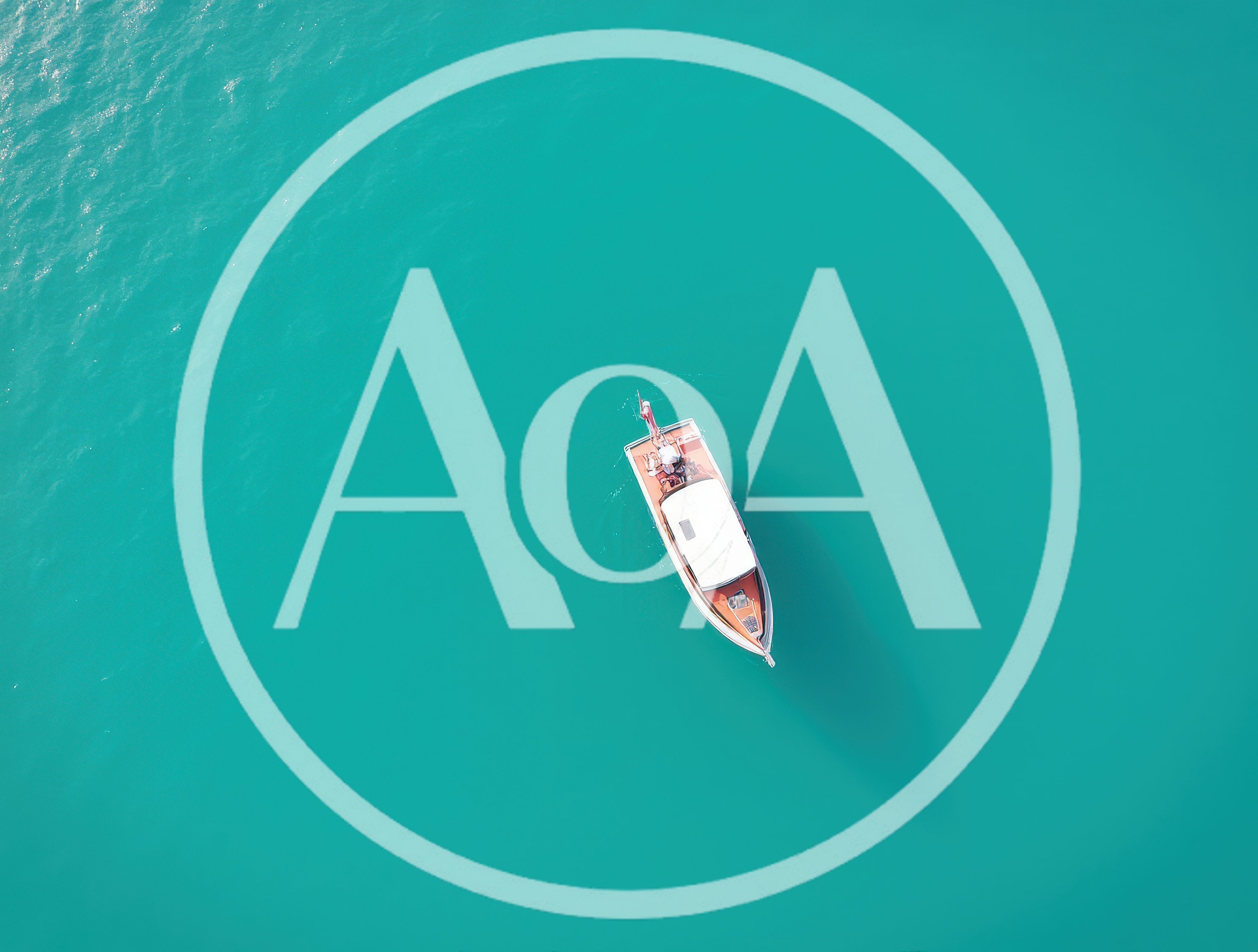 Aerial View Of A Classic Wooden Motorboat On Turquoise Water