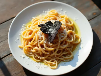 Spaghetti Pasta Topped With Black Truffle And Parmesan