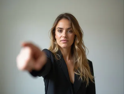 Professional Woman Pointing Directly At The Camera