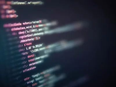 Abstract Programming Code Display On Dark Computer Screen