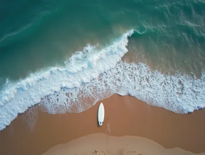 Aerial View Of A Surfboard On A Sandy Beach