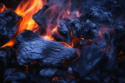 Glowing Embers And Flames In A Charcoal Fire