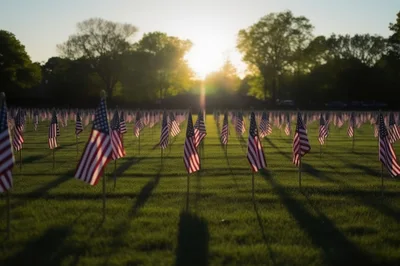 American Flags Displayed In A Cemetery At Sunset
