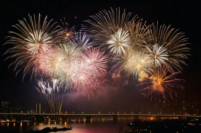 Spectacular Fireworks Display Over City Skyline And Bridge