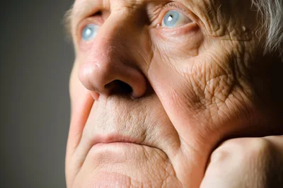 Close Up Portrait Of An Elderly Man Thinking