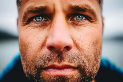 Close Up Portrait Of A Man With Blue Eyes