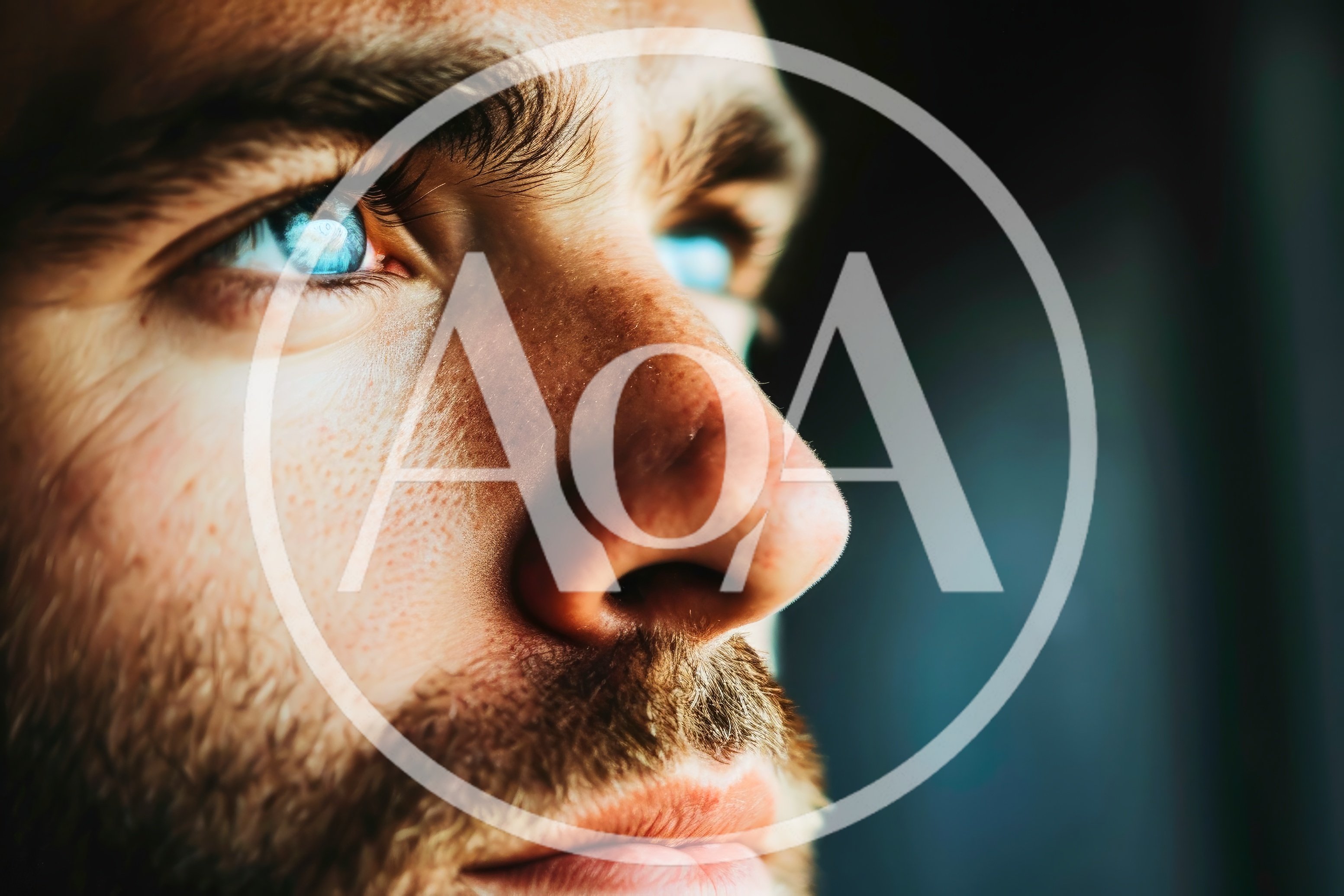 Close Up Portrait Of A Man With Piercing Blue Eyes