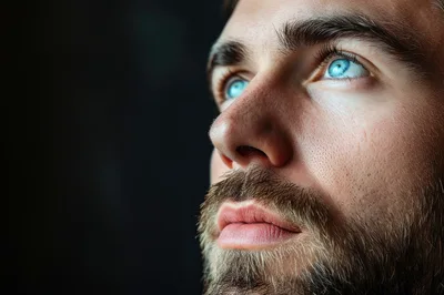 Close Up Portrait Of A Man With Bright Blue Eyes