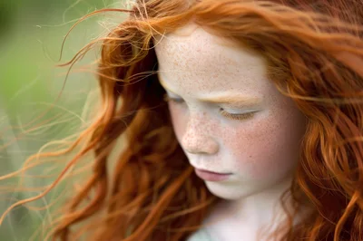 Portrait Of A Young Girl With Red Hair