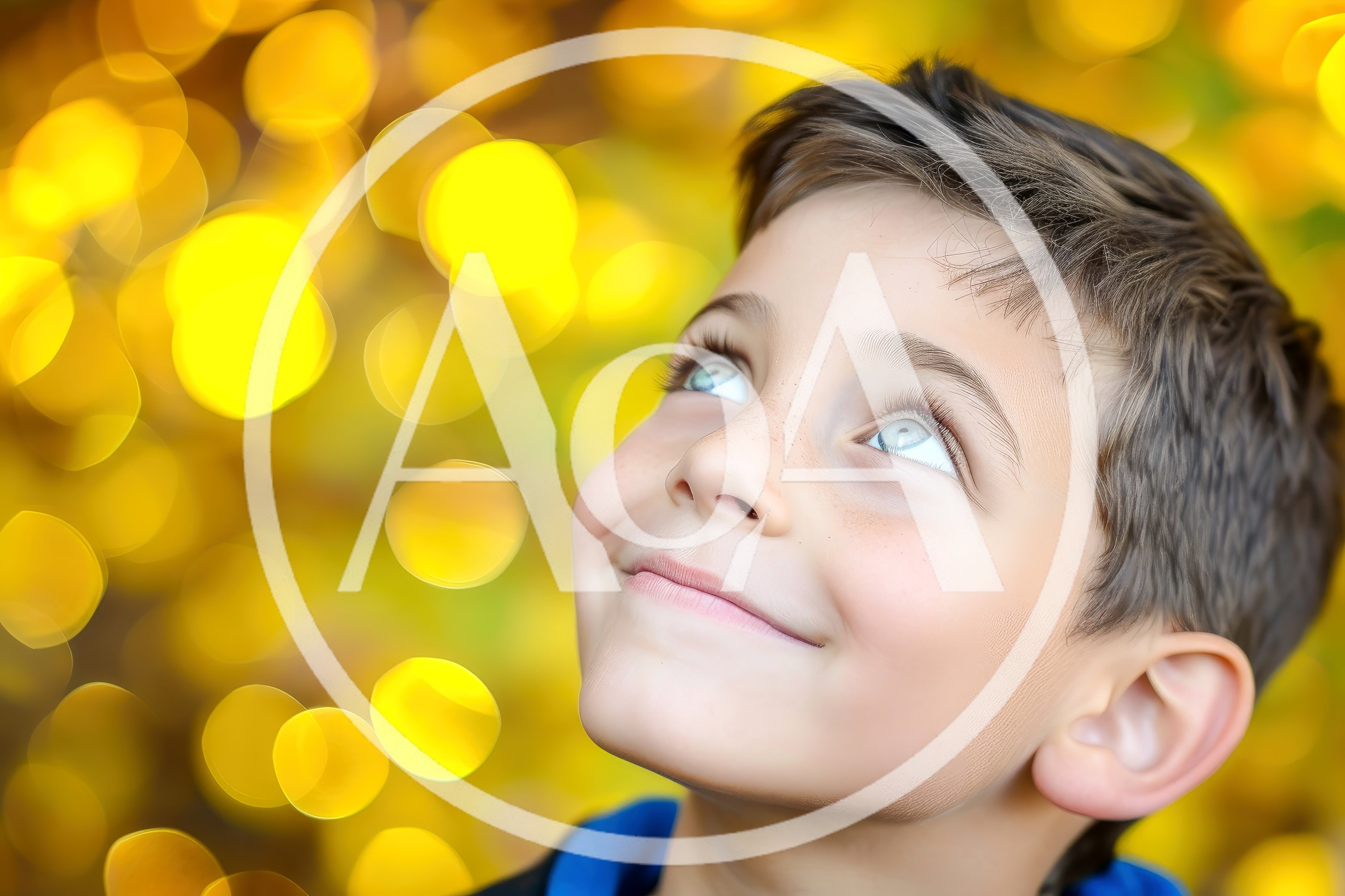 Young Boy Looking Upwards With A Joyful Expression