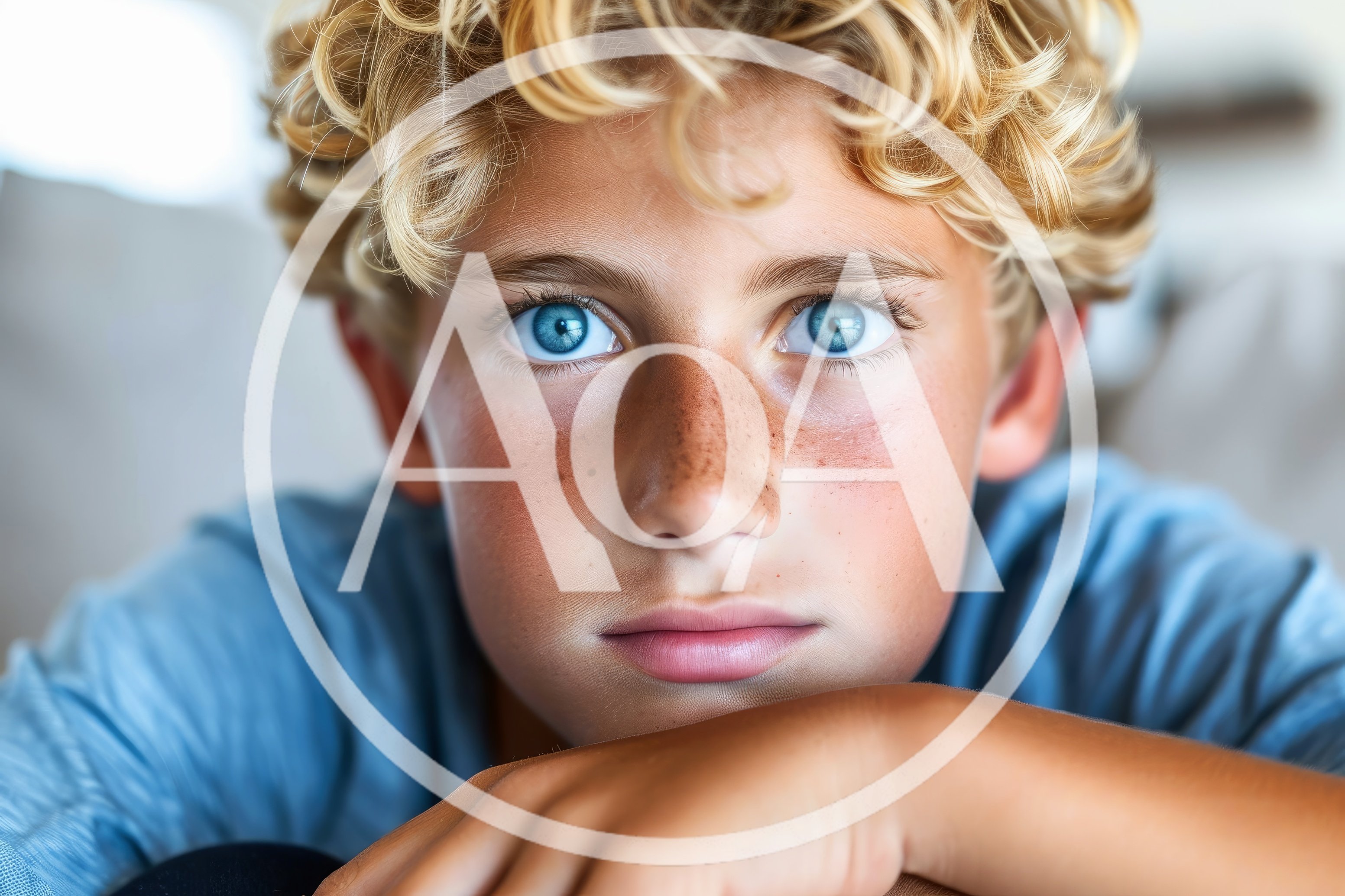 Close Up Portrait Of A Young Boy With Blue Eyes