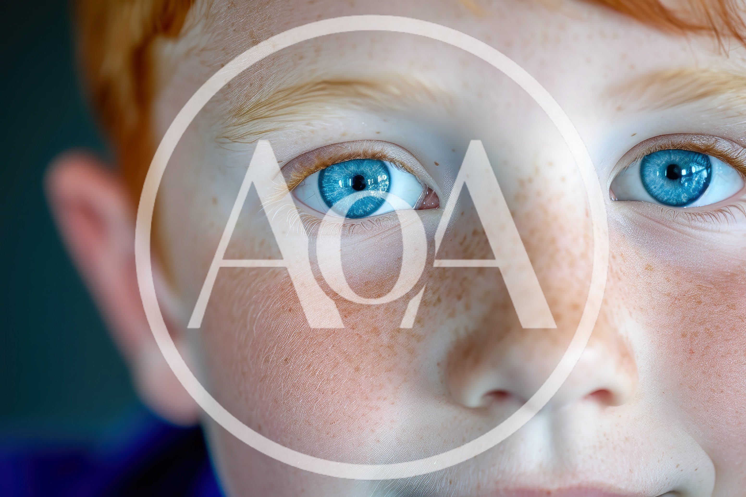 Close Up Portrait Of A Young Boy With Blue Eyes